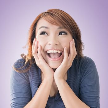 Excited happy Asian girl face, closeup portrait.