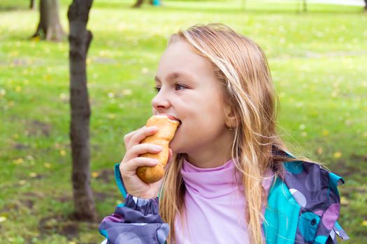 Photo of eating cute girl with blond hair
