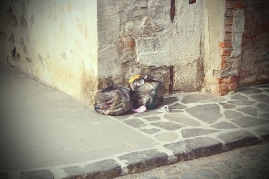 garbage left on the street, vintage look with vignette