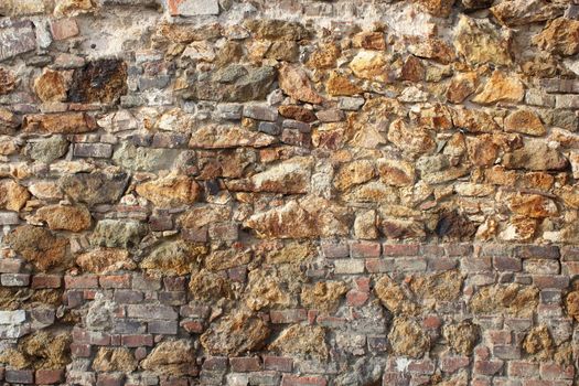 old wall of bricks and stones, texture for your architectural design