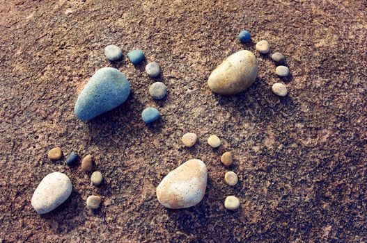 Amazing concept from stone, group of pebble as family illustration, foot step on rock, funny toe, pretty idea for design