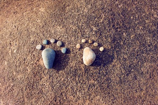 Amazing concept from stone, group of pebble as family illustration, foot step on rock, funny toe, pretty idea for design