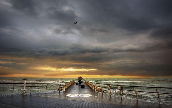 man watching a fisherman in front of a cloudy horizon