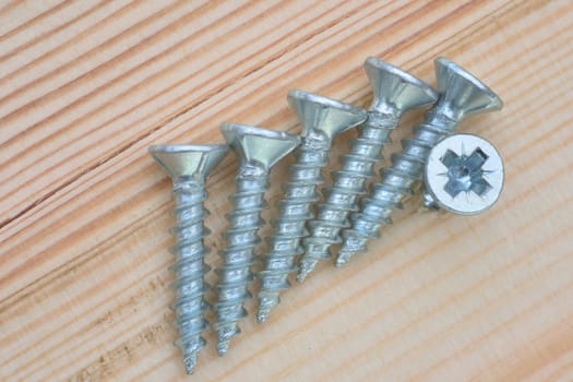 group of screws on wood