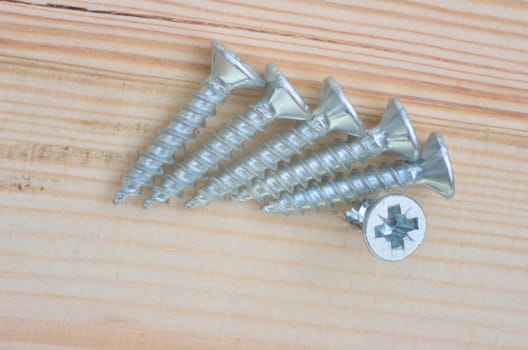 Group of screws with wood