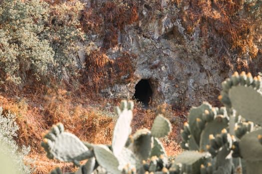 Face in a mountain with oneeye open and one closed