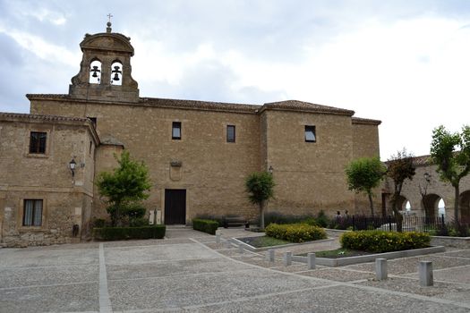 Church in the Plaza de Santa Clara, Lerma, Spain. Cloudy day in summer