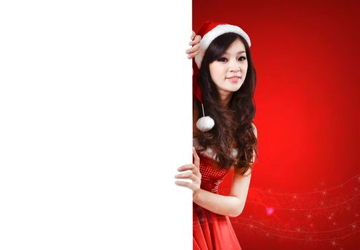 pretty women in santa outfit and christmas background