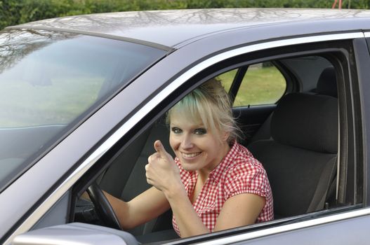 woman driving a gray car