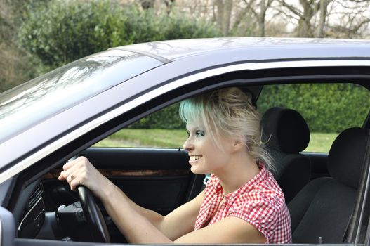 woman driving a gray car