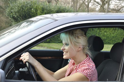 woman driving a gray car