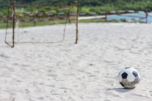football on the white beach