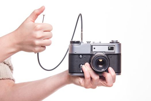 Classic 35mm old analog camera on white - studio shoot 