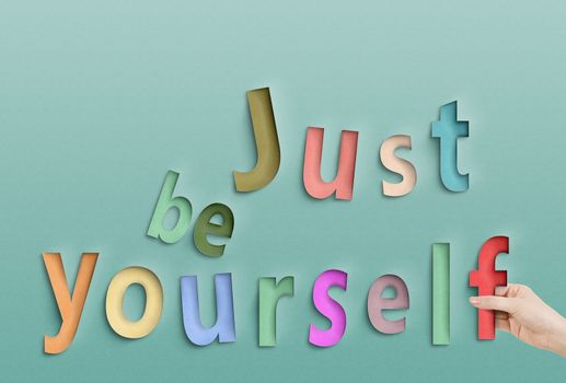 Just be yourself. Concept text on paper.