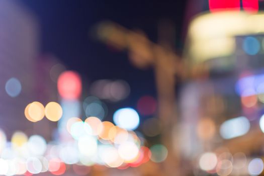 Abstract urban background with blurred buildings and street, shallow depth of focus.