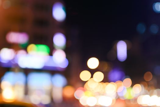 Abstract urban background with blurred buildings and street, shallow depth of focus.