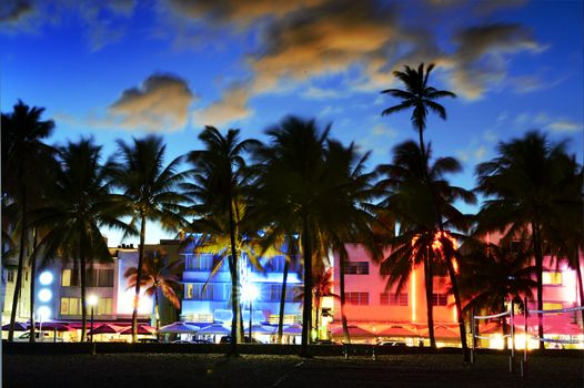 Miami Beach, Florida hotels and restaurants at sunset on Ocean Drive, world famous destination for it's nightlife, beautiful weather and pristine beaches 