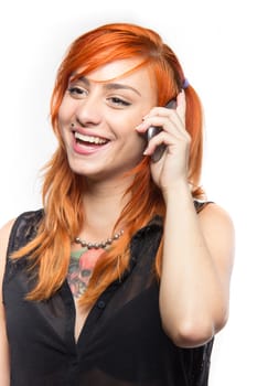 Red-haired young girl laugh on a  mobile 