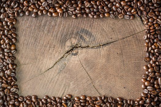 frame of coffee beans on stump background
