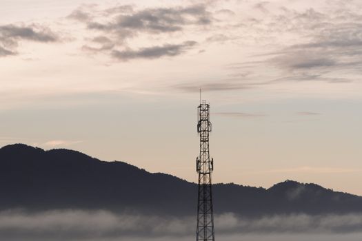 Telecommunication tower and sunset sky background 