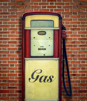 Retro Vintage Americana Gas Station Pump Against Red Brick Wall