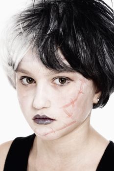 Portrait of a Young Girl in Wig Posing as Frankenstein