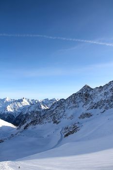 Ski lift chairs on bright winter day in Alp mountains