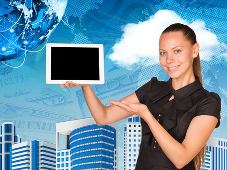 Beautiful businesswoman smiling and holding hand tablet with blank screen. Other hand points to tablet. Buildings, money and Earth as backdrop. Elements of this image furnished by NASA