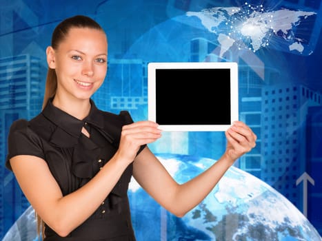 Beautiful businesswoman smiling and holding tablet pc with blank screen. Buildings and Earth as backdrop. Elements of this image furnished by NASA