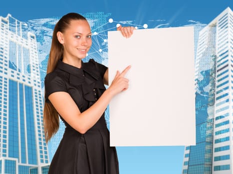 Beautiful businesswoman in dress smiling and holding empty paper sheet. Buildings and world map as backdrop