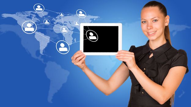 Beautiful businesswoman in dress smiling and holding tablet pc. Network with people icons and world map as backdrop