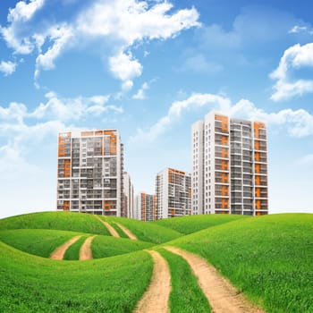 Tall buildings, green hills and road against sky with clouds. Architectural concept