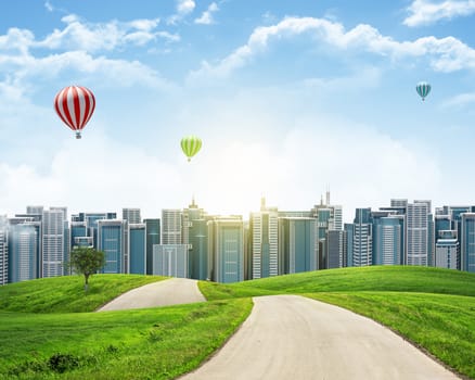 Tall buildings, green hills and road against sky with clouds. Architectural concept