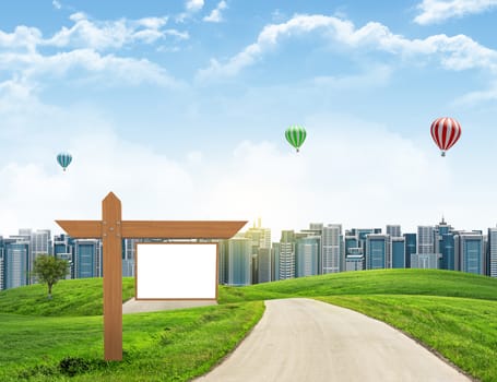 Tall buildings, green hills and road with wooden signboard against sky with clouds. Architectural concept