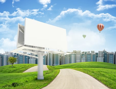 Tall buildings, green hills and road with large billboard against sky with clouds. Architectural concept