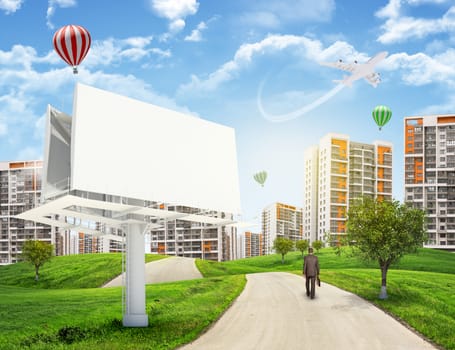 Businessman walks on road. Rear view. Buildings, grass field, large billboard and sky in background. Business concept
