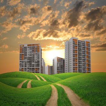 Buildings, green hills and road against dramatic sky with clouds. Architectural concept