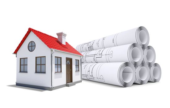 Small model house with red roof near scrolls of architectural drawings. Construction concept