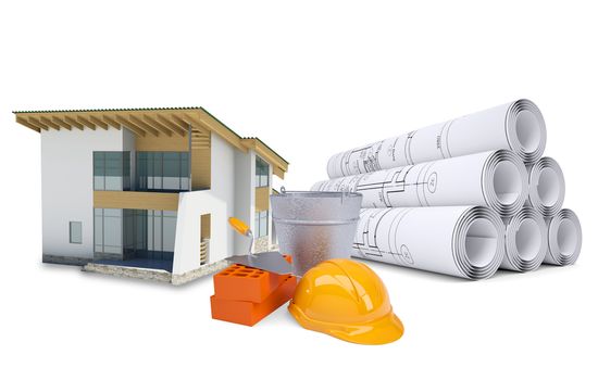 Small model house near scrolls of architectural drawings and work tools. Construction concept