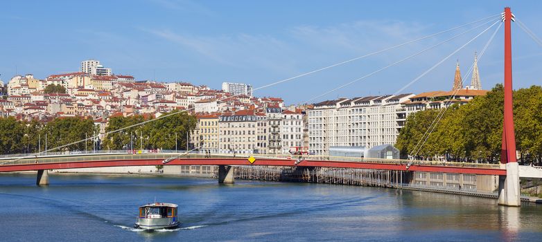 Panoramic view on Lyon and Saone river with boat, France