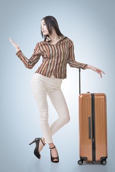 Modern Asian woman stand with a luggage in vintage style.