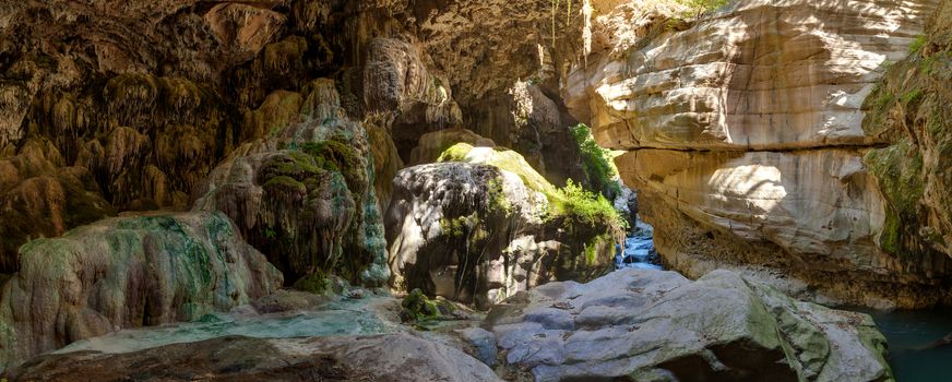 Cave with stalactites over the river Vorotan in Armenia at the bottom of the Vorotansky gorge