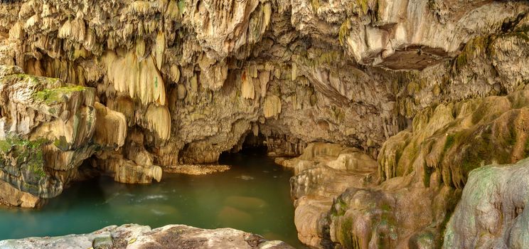 Grotto with stalactites over the river Vorotan in Armenia at the bottom of the Vorotansky gorge