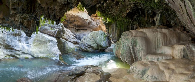 bowls of a mineral source in a grotto at the bottom of the Vorotansky gorge