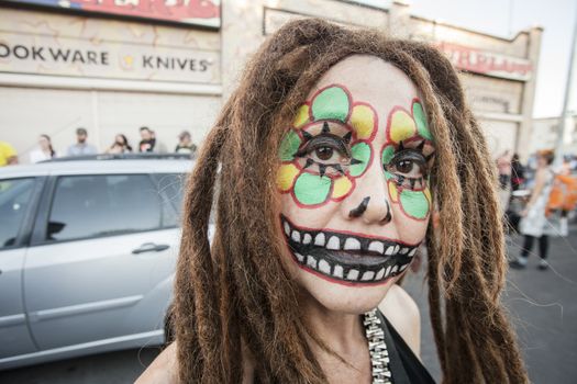 TUCSON, AZ/USA - NOVEMBER 09: Unidentified young woman with dreadlocks facepaint at the All Souls Procession on November 09, 2014 in Tucson, AZ, USA.