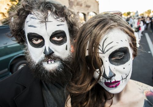 TUCSON, AZ/USA - NOVEMBER 09: Two unidentified people in dramatic facepaint at the All Souls Procession on November 09, 2014 in Tucson, AZ, USA.