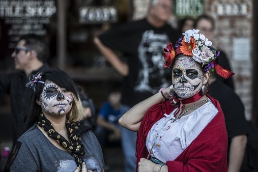 TUCSON, AZ/USA - NOVEMBER 09: Two unidentified women in facepaint at the All Souls Procession on November 09, 2014 in Tucson, AZ, USA.