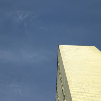 Gold brick building against blue sky