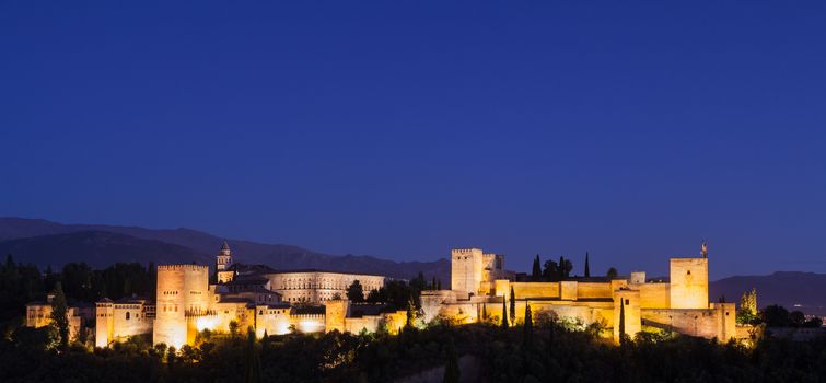 Spain, Granada. The famous Alhambra Royal Palace by night from the best viewpoint