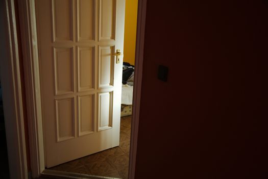Light coming from a room with door left ajar